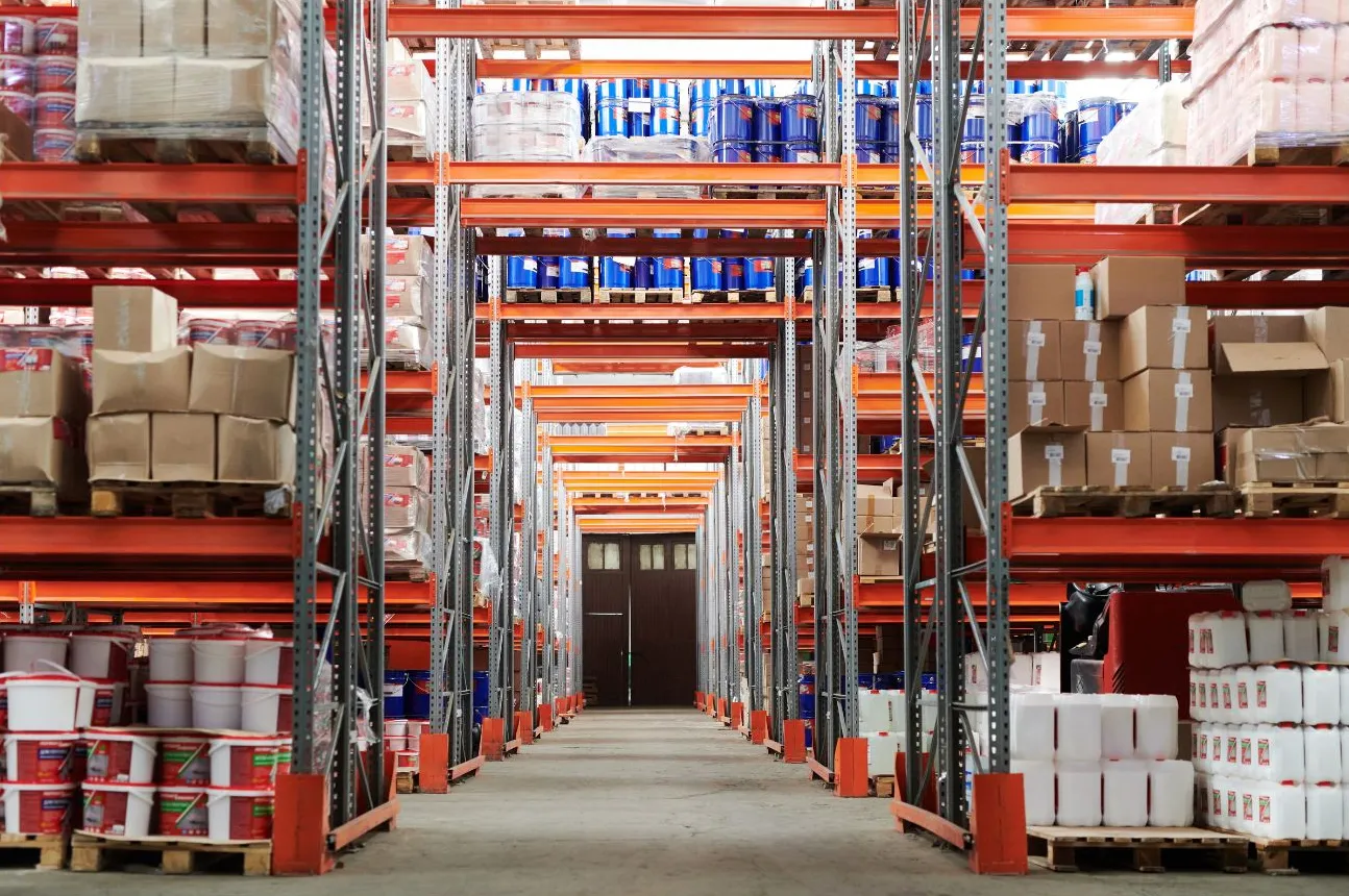 Neatly organised warehouse racking stocked with pallets