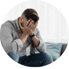 A man sitting with his head in his hands